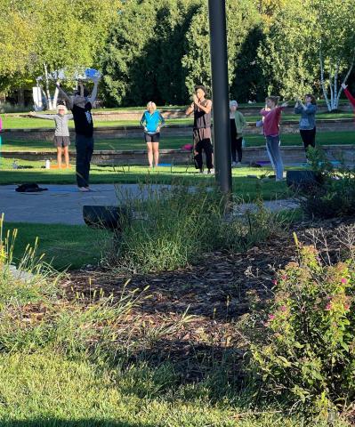 Matthew leading a yoga class at the Chanhassen Farmers' Market