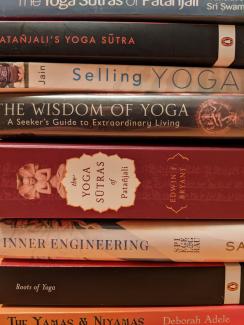 A stack of yoga books