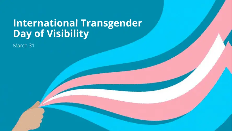 The words Transgender Day of Visibility with a hand waving blue and pink ribbons