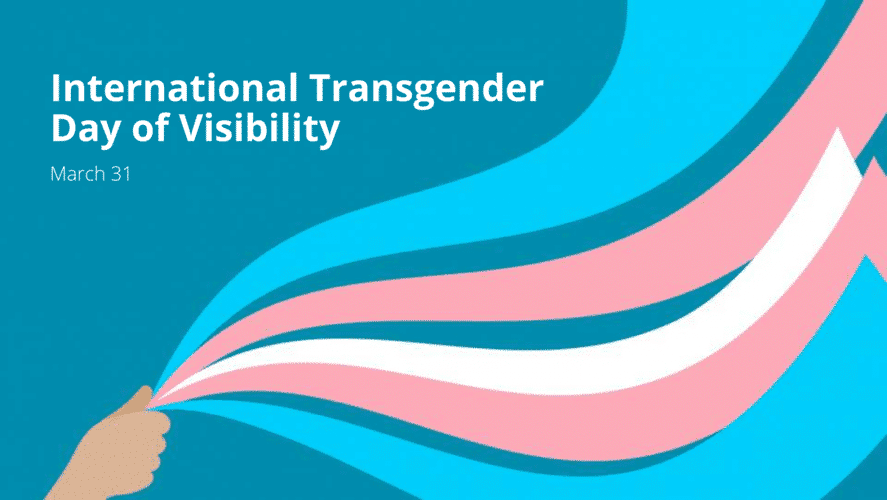 The words Transgender Day of Visibility with a hand waving blue and pink ribbons